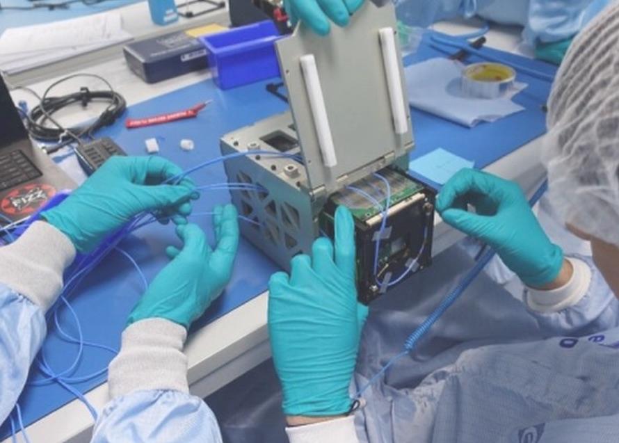UBC Orbit team integrating satellite hardware